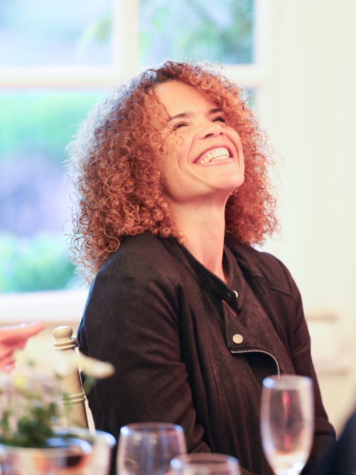 Sabrina Pace-Humphreys laughing at a table